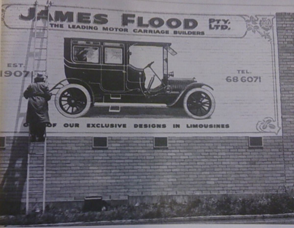 James Flett painting the vintage sign on Sunshine Road