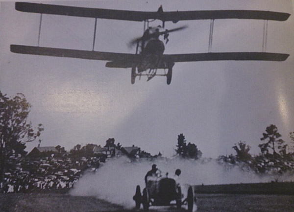 Itala racing an aeroplane at Aspendale race track
