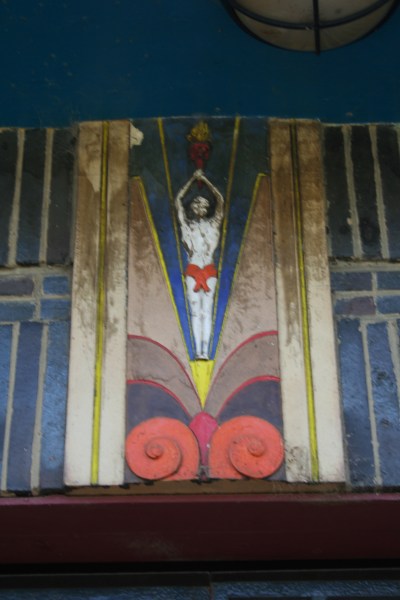 Figure of a heroic athlete over the entrance