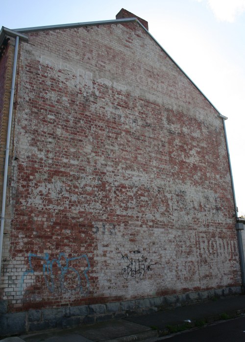 Grocer with faded ghostsigns